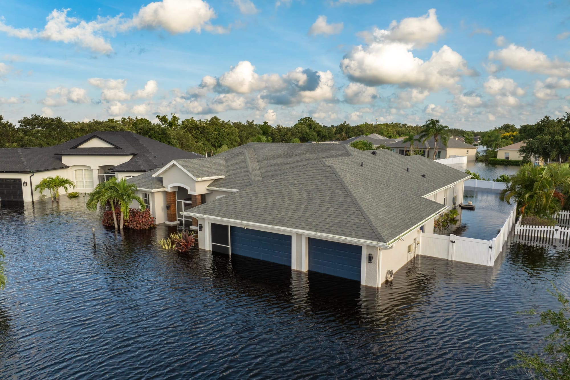 Flooded houses from hurricane rainfall water in Florida residential community