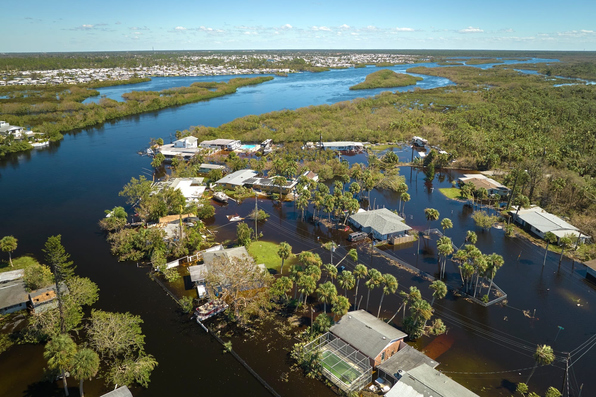 Hurricane Ian flooded houses in Florida residential area. Natural disaster and its consequences