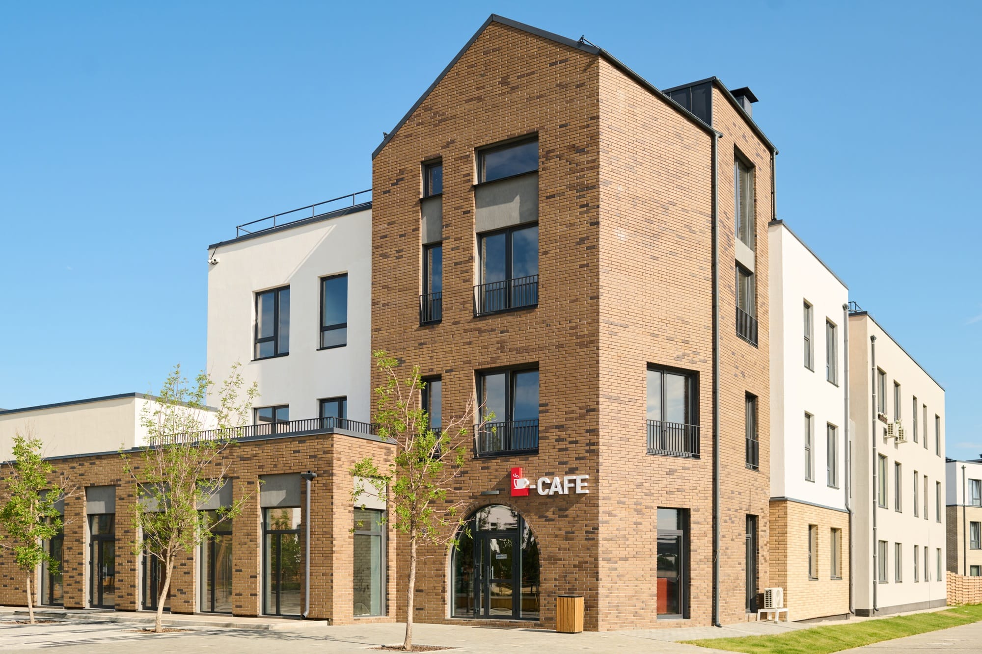 Part of large street with corner of three storey residential building